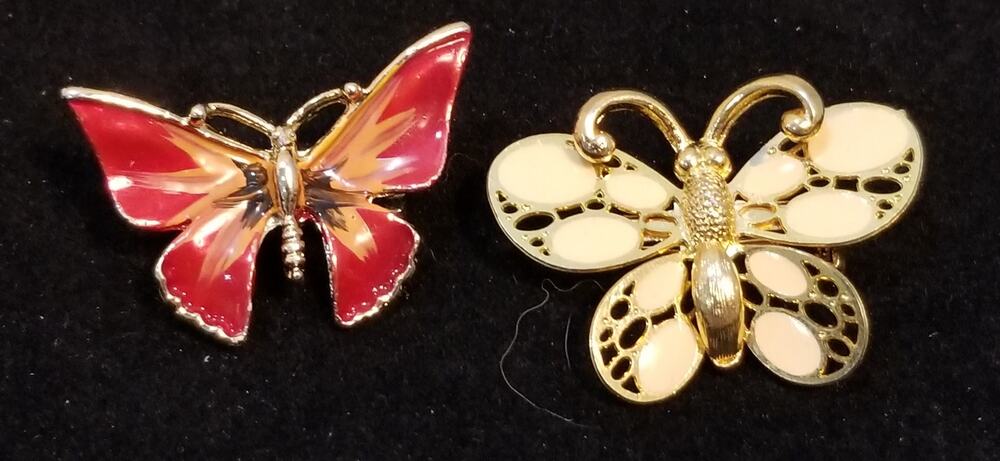 Two gold tone butterfly brooches both 1 1/2" x 1 1/2"  both enamel